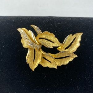 Vintage BSK gold tone floral brooch with rhinestones